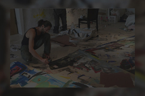 Adrien Brody working on artwork image